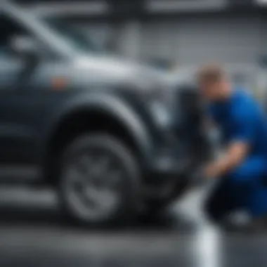 Technician performing maintenance on a vehicle