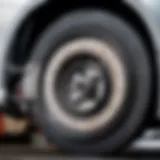 Detailed view of a car brake system showing wear and tear.