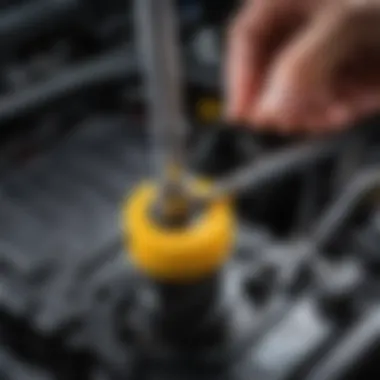 Close-up view of a transmission dipstick showcasing oil texture