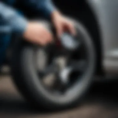 A person checking tire pressure with a gauge