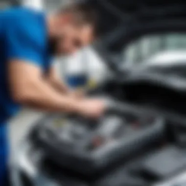 Mechanic using diagnostic tool on BMW vehicle