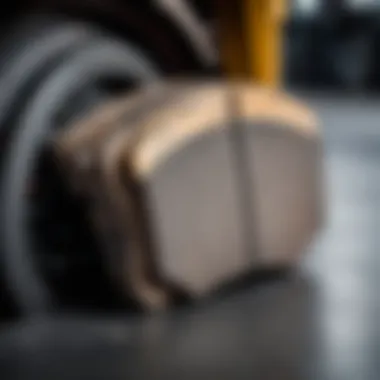 Close-up of worn brake pads