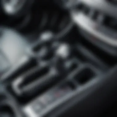 Location of the parking brake lever in a Kia Sportage interior
