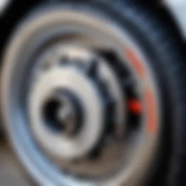 Close-up of a wheel with a brake caliper showing signs of malfunction.