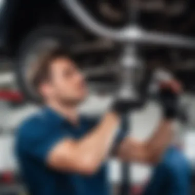 Mechanic inspecting a vehicle's front suspension