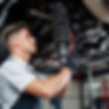 A mechanic examining a vehicle's suspension system