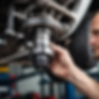 Mechanic inspecting a CV joint for issues