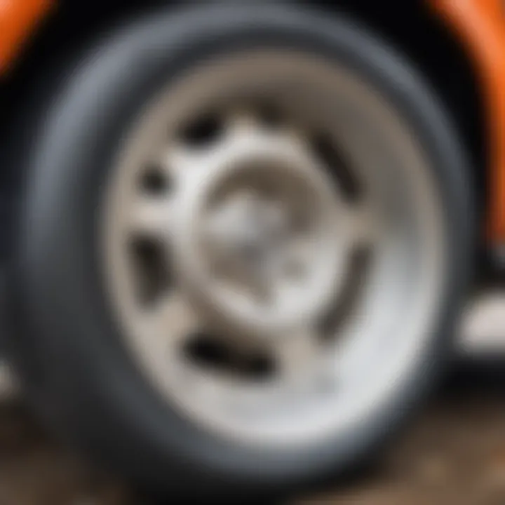 Close-up of a vehicle's front wheel with visible wear