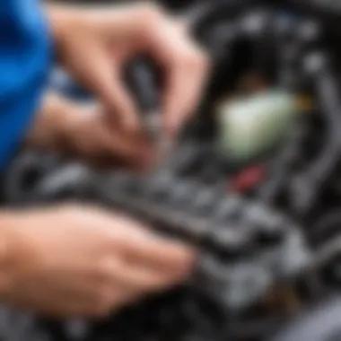 Mechanic inspecting fuel injectors in a Kia Spectra