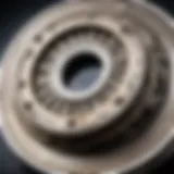 A close-up view of a vehicle clutch showing wear and tear