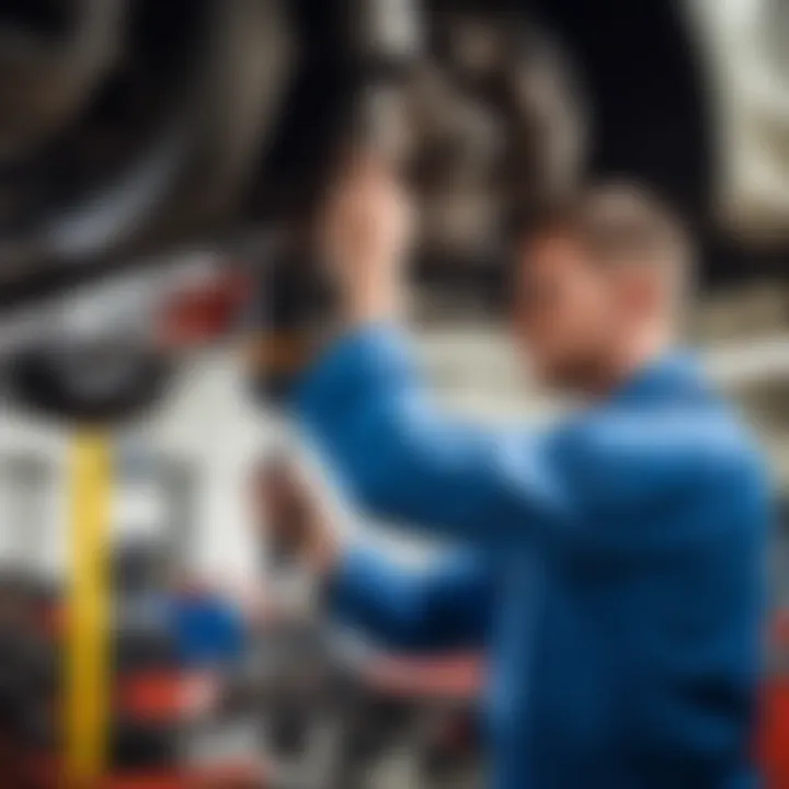 Mechanic inspecting a Ford vehicle's suspension system.